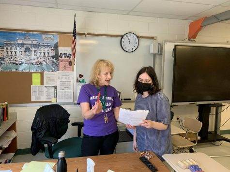 Senior Pearly Gal-Edd discusses an essay grade with Italian teacher Maria Cavallini. As the number of students requesting grade adjustments spiked towards the end of the last marking period, teachers have stressed that building a strong rapport through consistent contact goes a long way to having their requests fulfilled.