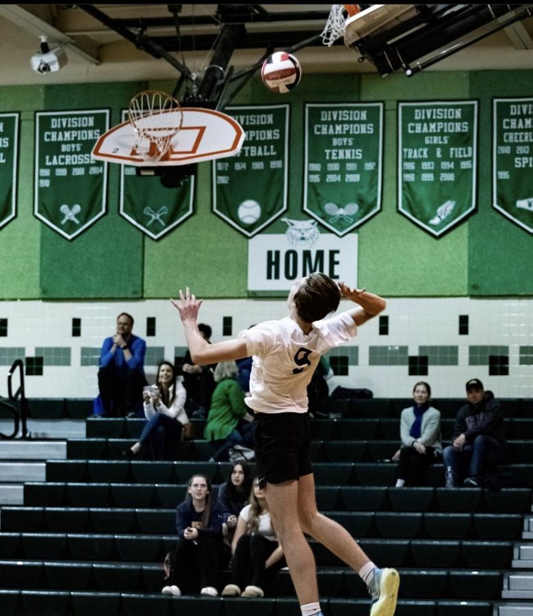 Junior captain Seba Sani jumps up for a spike to help his team add points to their score. Sani helped WJ win this game to add to their impressive record.
