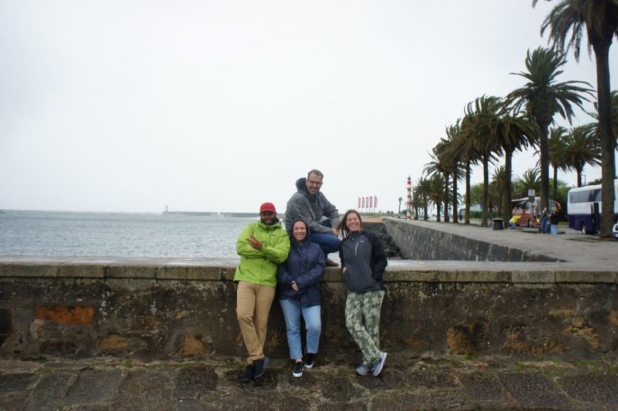Tour guide Jaime and chaperones Jason Campbell, Kim Rief and Elizabeth Muehl posing by the waterfront on their way to Porto.
