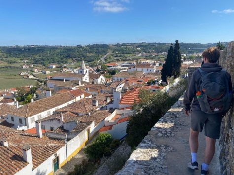Junior Nik Avillo climbs the medieval walls of Obiods during his trip to Portugal over spring break. He notes that this part of the adventure was most special because of its uniqueness, history and beautiful scenery.
