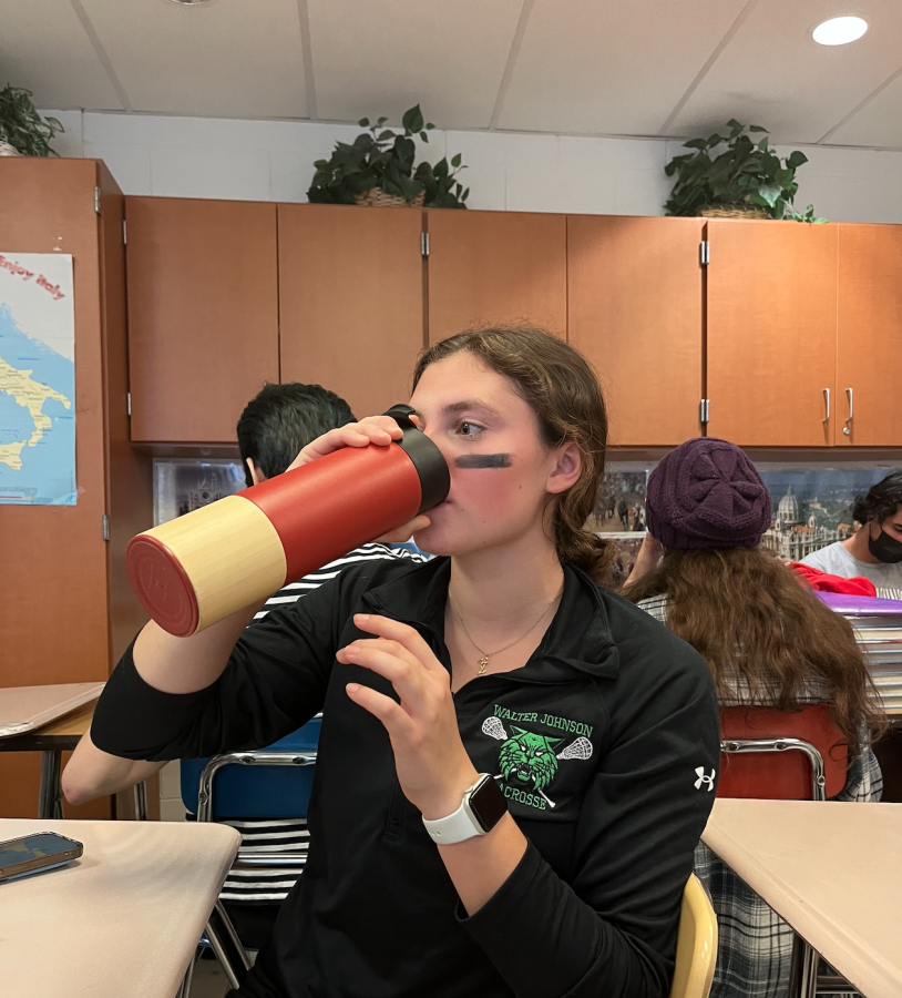 Sophomore Anna Zucconi drinks from her reusable water bottle. Taking care of the environment is important to her, so she lowers her waste by using a reusable bottle. My water bottle reduces plastic use in the environment which makes me feel like a better person, Zucconi said.