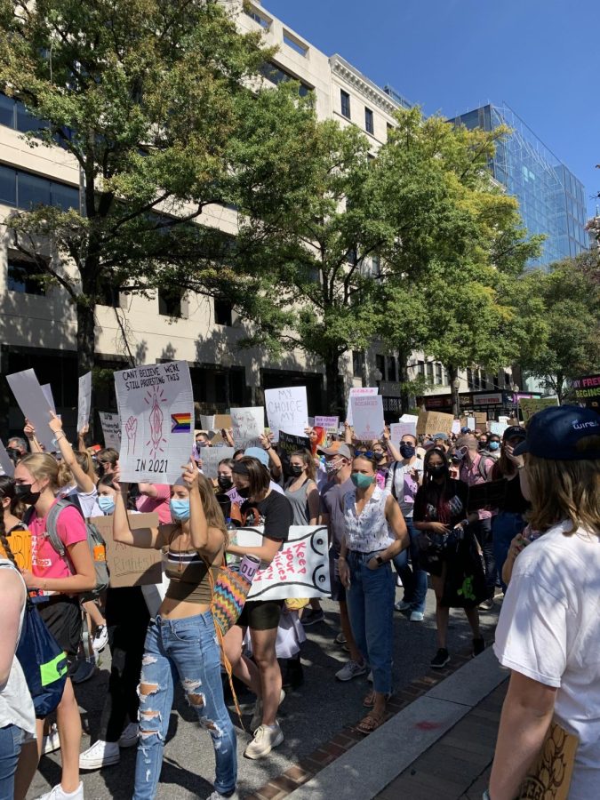 Protestors+gathered+with+Womens+March+to+protest+abortion+bans+in+front+of+the+Supreme+Court.+The+ongoing+debate+regarding+the+possible+overturn+of+Roe+v.+Wade+has+created+a+huge+divide+between+political+parties.