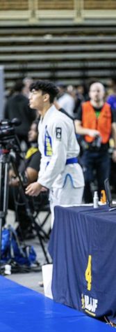 Enzo Yamasaki standing on the podium after a great fight. Yamasaki has won many matches throughout his jiu jitsu career.