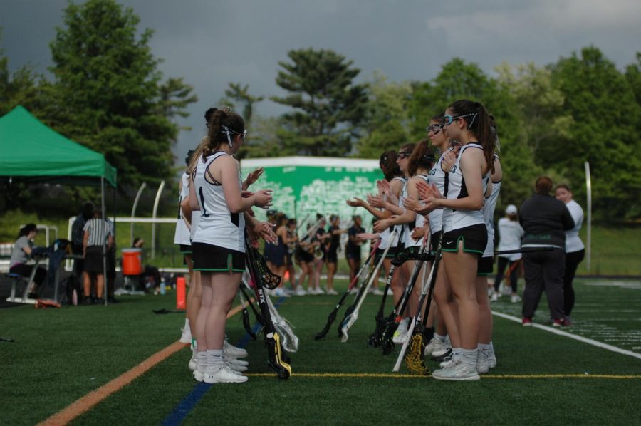 The WJ girls lacrosse team in their two lines, applauding B-CCs players before the first game of the playoffs season. The B-CC team has a long standing rivalry as both teams are quite competitive and talented.
