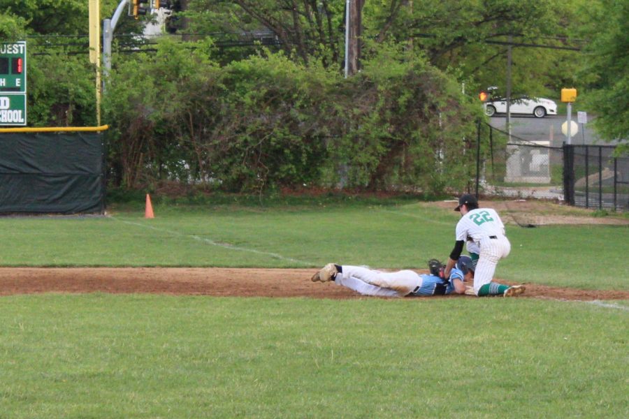 Wildcats batter goes down after receiving a pitch to the ankle. The umpire called for a hit by pitcher giving the Wildcats a courtesy run.