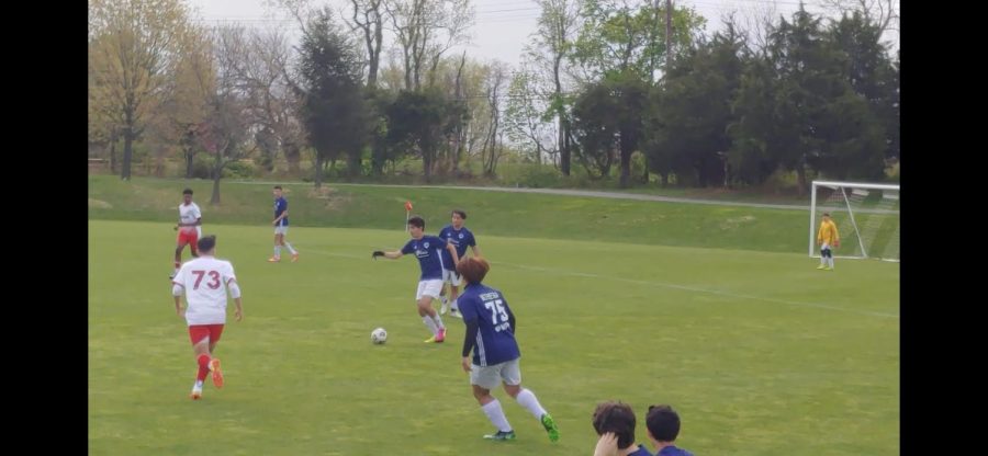 Junior Keon Abasi looks to pass the ball during a U17 Bethesda White soccer game. Abasi played as a six before he became a permanent center defender.