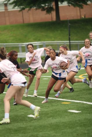 Junior Aranda Hurge tries to make a juke against senior Trinity Hill.  While , she does this her teammates Yness  Seidnaly, Isabella Mondelli, and Rita Bousadi run with her as they  all try to advance down the field.