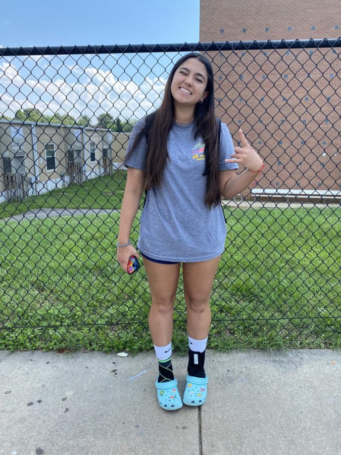 Freshman Alexandra Royzman wears a volleyball tournament t-shirt, athletic shorts, and trendy crocs.¨I enjoy dressing down for school because I find it is more fun to be comfy at school¨