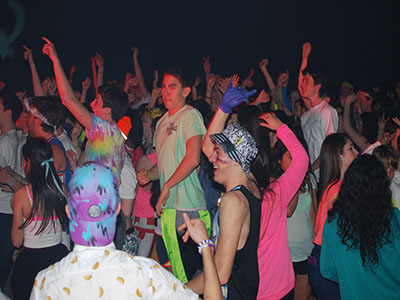 Walter Johnson students dressed and dancing for the 2019 Glo fundraiser.