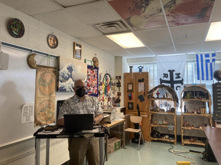 Social studies teacher Mitchell Joy prepares to teach a class. In addition to being a social studies teacher, Joy holds a Religious Literacy course over the summer for teachers.