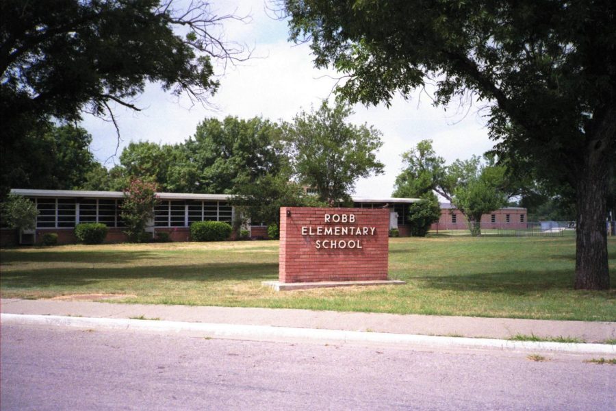 The sign outside Robb Elementary, the site of the devastating shooting that took place on May 24.
