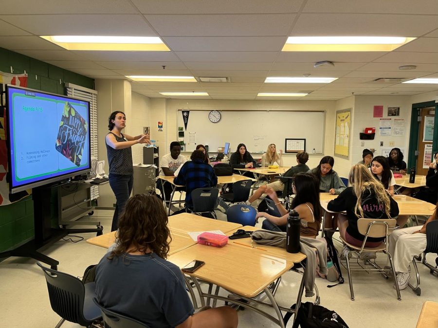 Leadership teacher Sophie Fierst instructs the leadership class on daily class agenda. They are currently working on planning for Homecoming hallways.