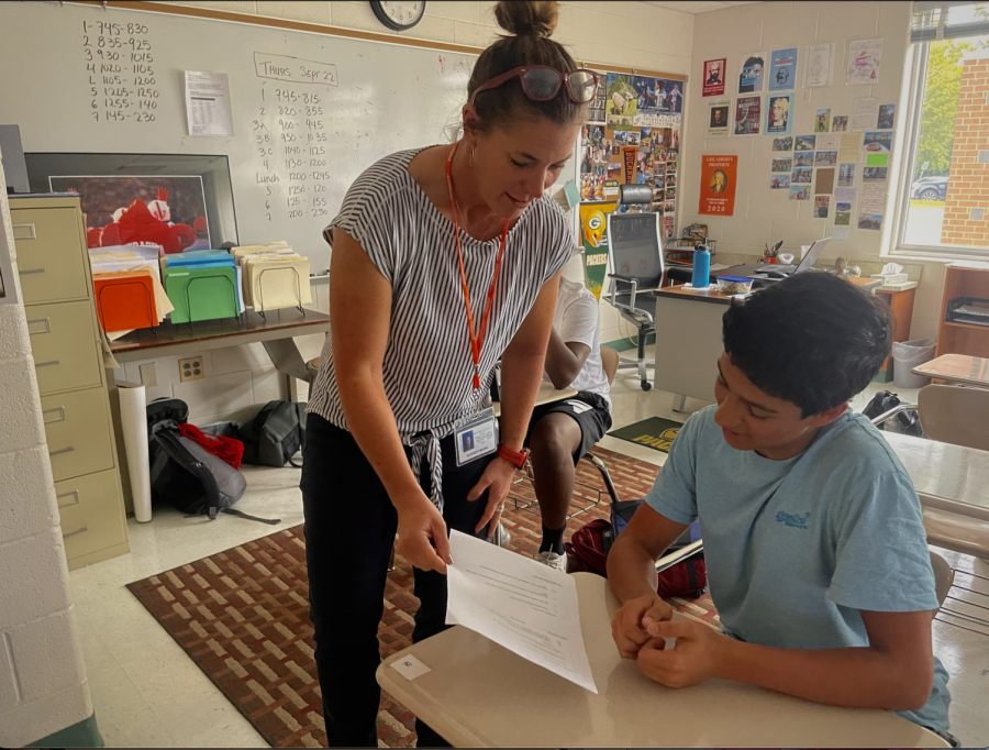 Student Kiran Chaudry and AP Human Geography teacher Elizabeth Muehl go over a hard copy assignment. More teachers have been handing out hardcopy assignments, distancing from the Covid-19 norms of electronic assignments.