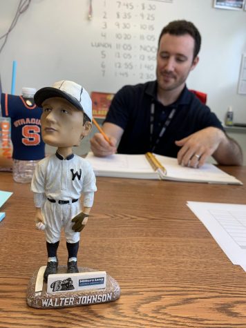 A bobblehead version of the famous Walter Johnson nods at students passing by English teacher and baseball fan, Jason Krakower. Krakower was both a baseball player, as well as an editorial producer for Major League Baseball Advanced Media before he joined WJs English department.