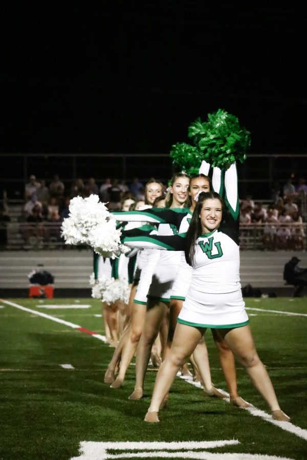 The poms team performs at halftime. Junior Alexa Steinberg led the line of her teammates. 