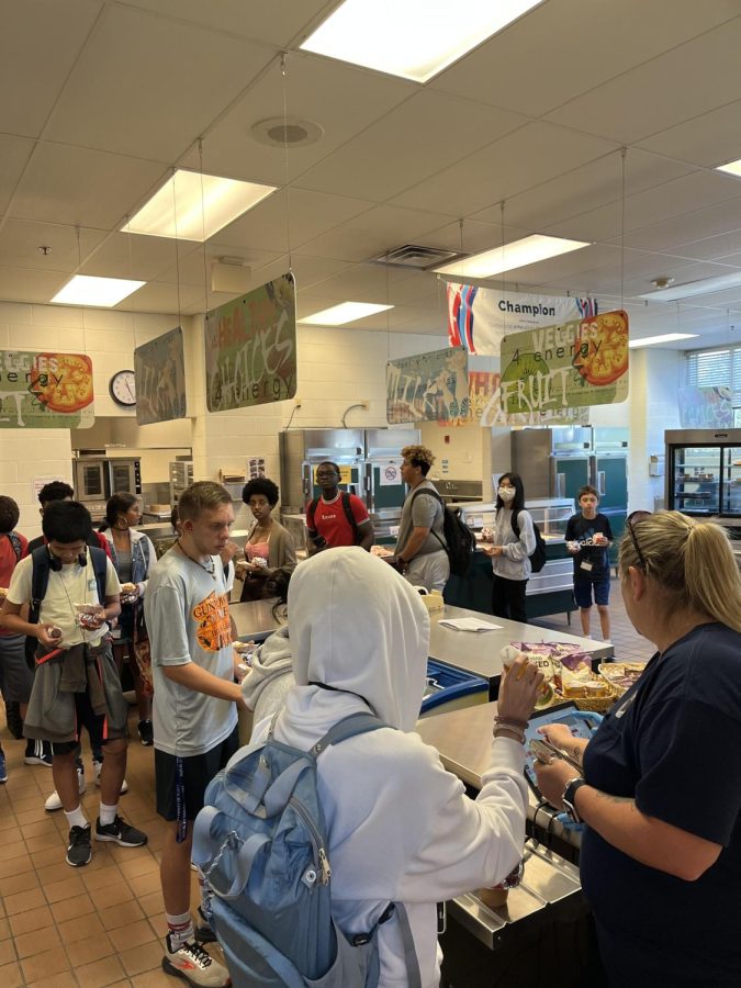 Cafeteria manager Stefanie Atwood is seen checking out students in the lunch line. Fewer students have been seen going to the cafeteria during lunch.