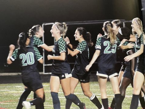 The girls soccer team celebrates scoring a goal during the 2021 season. After losing to the Whitman Vikings in the regional semi-final last year, the Wildcats have high state championship aspirations for 2022.