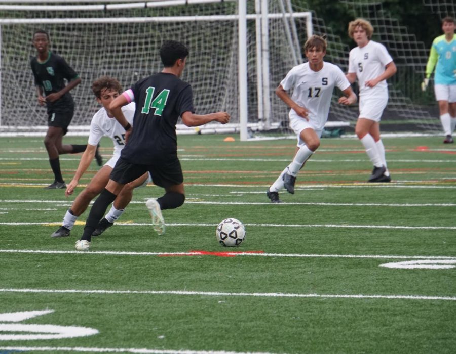 Senior captain Leo Macdonald tries to create space and look for an opportunity to advance the ball. Macdonald is a midfielder which means hes responsible for keeping the defensive and offensive lines together.