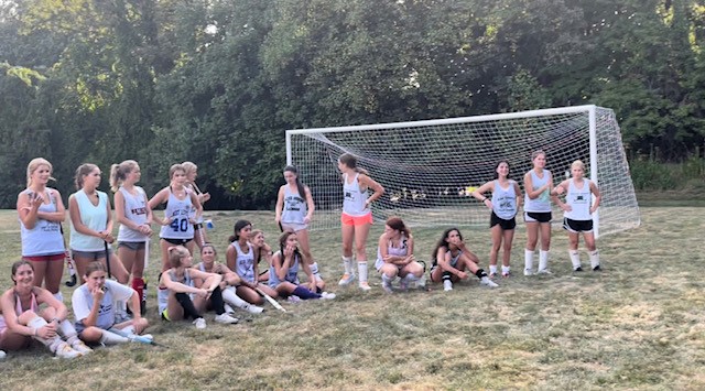Varsity field hockey practices at Tilden Middle School. The team has become accustomed to practice off campus as there is limited turf field time available for sports.