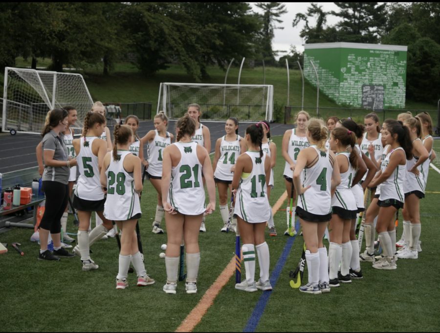 Varsity field hockey coach Laura Brager prepares her team before starting a game. Field hockey is known as one of the sports that is easier to make.