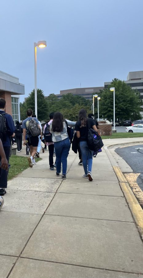 Students walk towards the cafeteria entrance outside the bus loop before school. This was a commonly used entrance in the first week of school for students exiting buses.