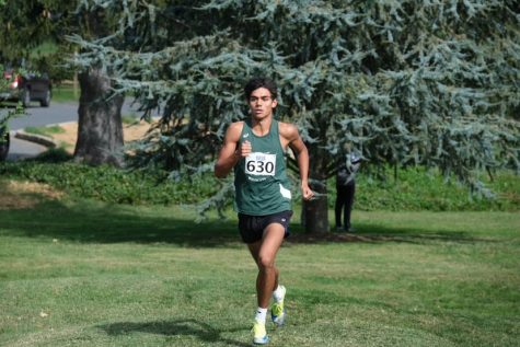 Junior Calix McCormick paces himself in the Invitational. He finished 9th overall and led the boys to a 3rd place overall finish.