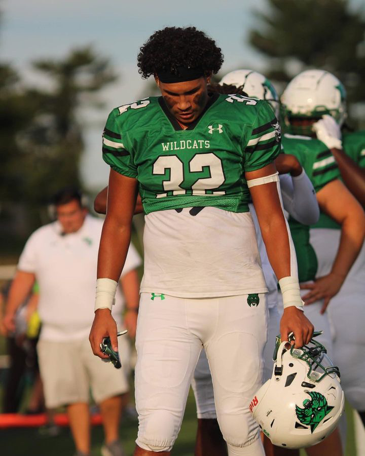 Senior captain and linebacker/running back CJ Newman prepares himself for the start of the game. To get ready, he listened to music including the song, Forever by Drake. Sometimes before a game Ill give a little pep talk to the team, pretty much telling everyone to have confidence, Newman said.