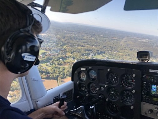 Senior Patrick Adams flies a plane as a part of his flight program. Adams plans to get his pilots license by the spring, so he can apply to a college with a Navy ROTC program to continue his flight training.