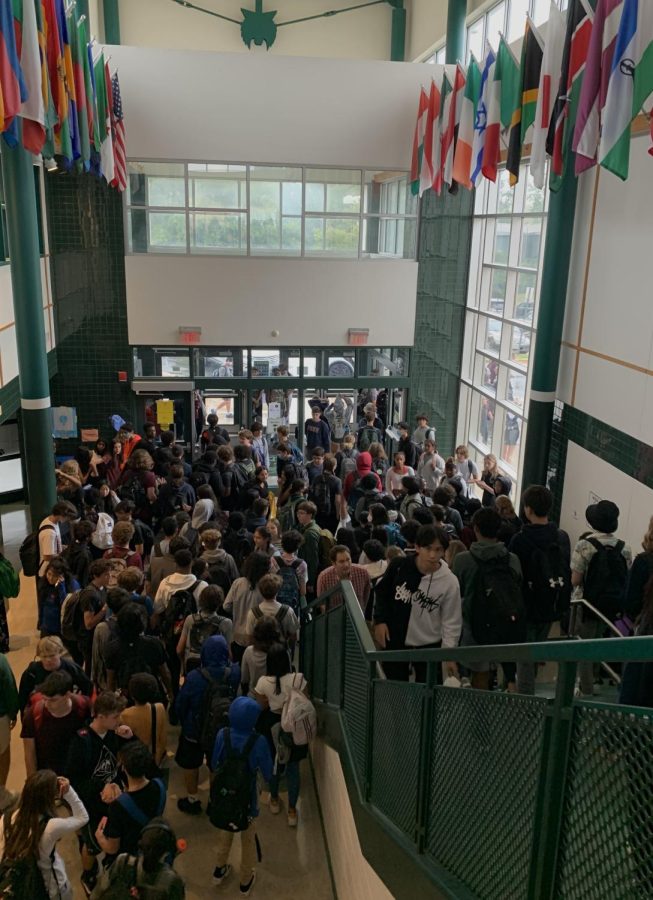 As the dismissal bells chime throughout the school, upperclassmen go to their designated parking spot while underclassmen wait at the pick up spot.