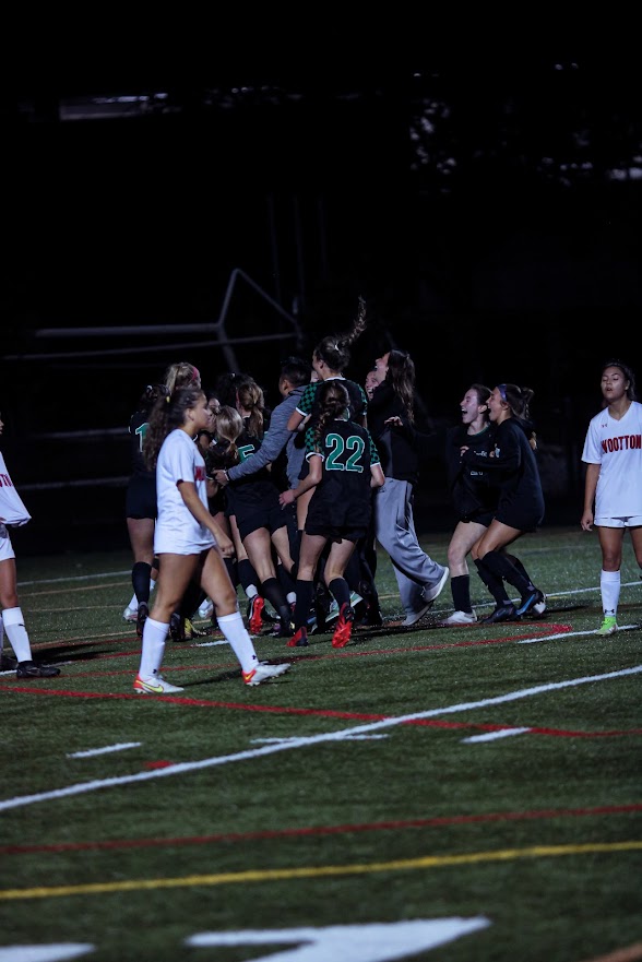 The+girls+soccer+team+celebrates+junior+midfielder%2Fforward+Irene+S%C3%A1nchez+Burgue%C3%B1os+game-winning+goal+in+overtime.+The+Cats+defeated+the+Wootton+Patriots+2-1+to+improve+their+record+to+7-0.