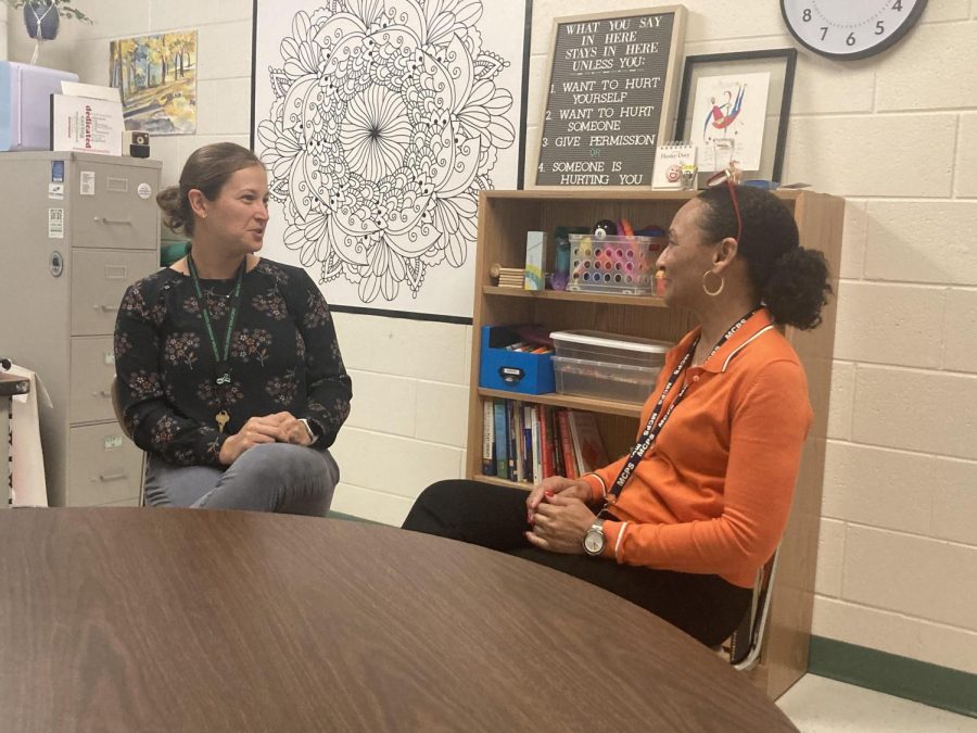 School Social Worker Caroline Kennedy speaks with Pupil Personnel Worker Valerie Toole. A key part of Kennedys job is communicating with students and staff.  Kenndey has sought to build relationships with her co-workers and students.