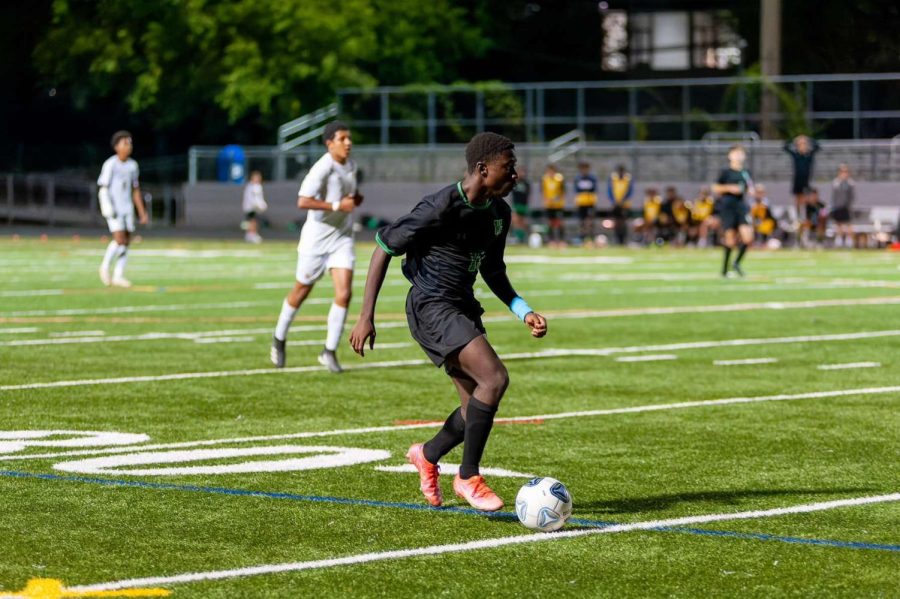 Junior Sid Scale dribbles the ball down the pitch as WJ takes on the Richard Montgomery Rockets. Scale plays on both sides of the field as hes one of the wingbacks for the Wildcats.