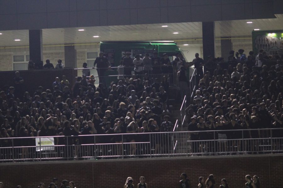The WJ student section cheer on the team in their blackout theme. The Wildcats claimed victory against the Barons 20-14.