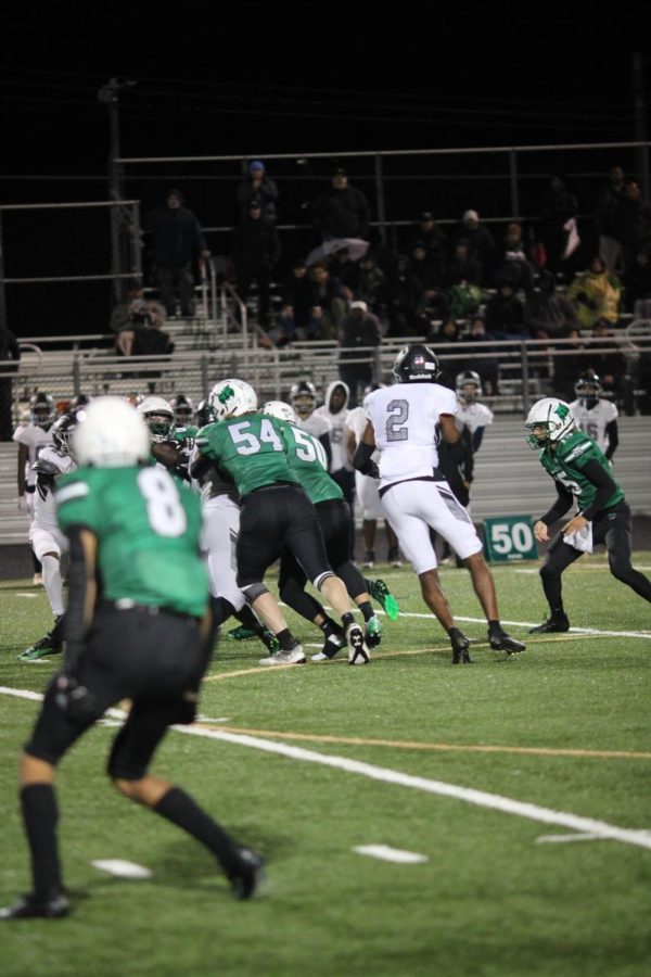 Senior quarterback Andrew Plotnick hands the ball to freshman running back Dylan Byrd. Northwest trailed the entire game while trying to stop the WJ offense from continuing their successful.