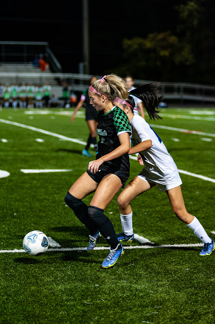 Senior captain and midfielder Vivian Vendt dribbles past a defender. Vendt was able to score as the Cats defeated Churchill 3-1.