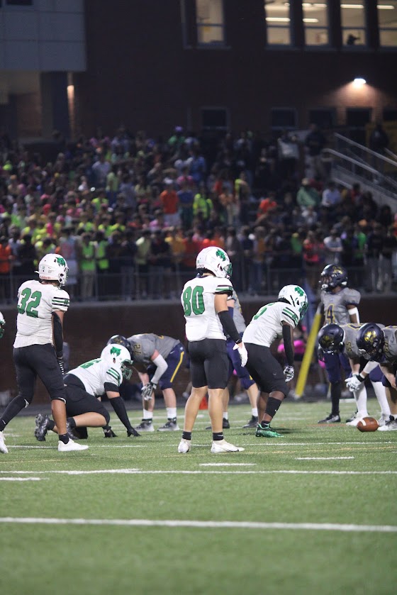 Senior captain and linebacker CJ Newman and junior wide receiver/defensive back Nick Zampardi line up to try and stop the Barons triple option offense. Zampardi was able to record an interception during the game.