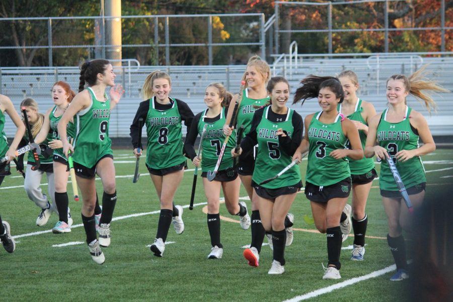 Senior Cats getting fired up to take the field against Sherwood High School. After four years of green and black, the Cats were able to go out with a bang!