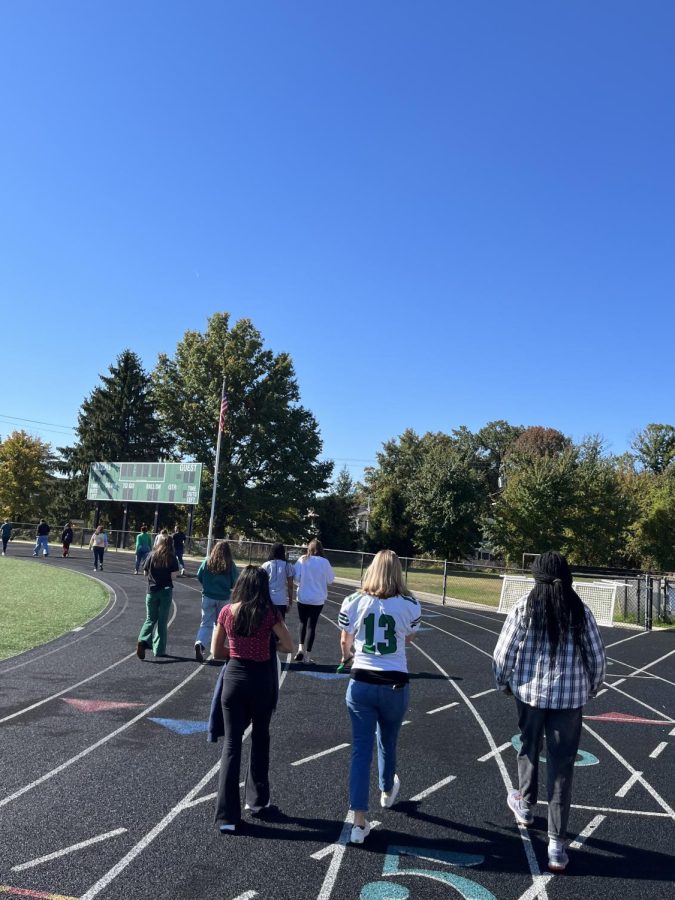 Students+and+staff+participate+in+the+Walk+for+Wellness+on+the+track+during+lunch.+While+more+students+were+expected%2C+a+few+passionate+participants+came+out+to+finish+the+week+off+strong.