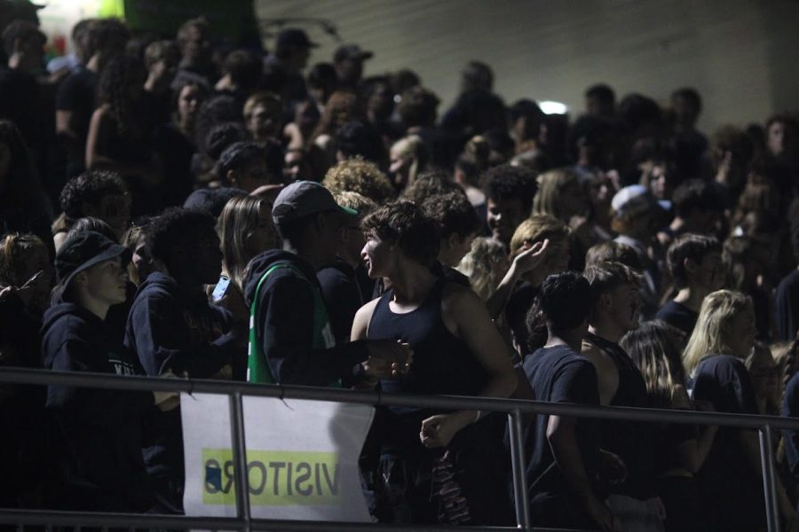 The student section cheers on the football team as they face BCC. Only students from the participating schools are allowed to attend athletic events unless they have a chaperone with them.