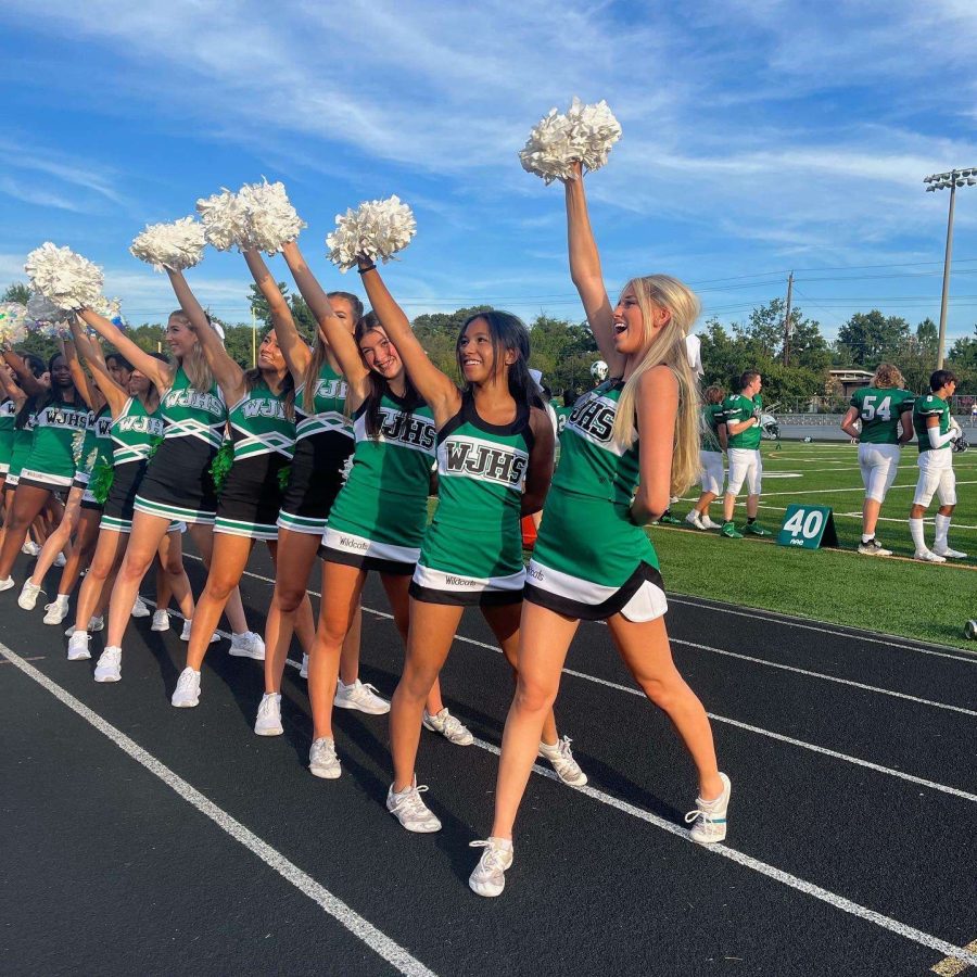 WJ cheer excites fans at the first home game of the year. They make sure to get the student section hyped at every game.