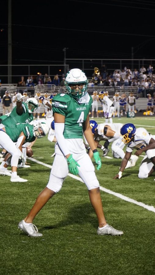 Senior wide receiver Christion Wright prepares for the ball to snap. Wright and the offense scored a total of 28 points in the first three quarters, but failed to put any points on the board in the fourth. 