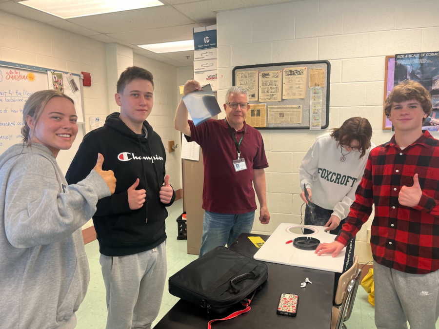 Senior designated hitter Hadley Brown helps students in Mr. Lorenzis astronomy class every day. I really enjoy getting to make students and Mr. Lorenzis life easier, Brown said.