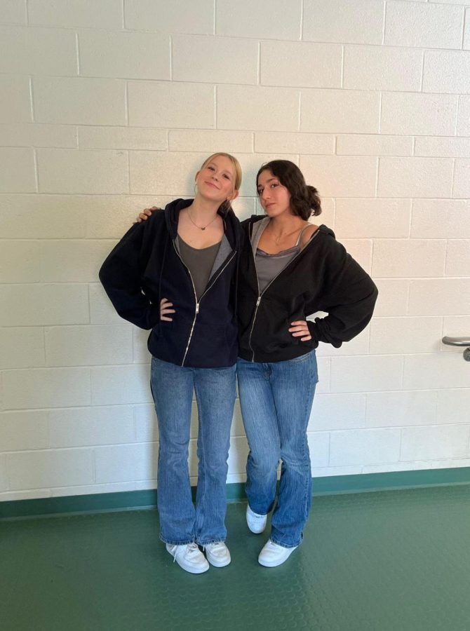 Sophomores Ariel Mazor and Claire Kuemmerle show their team spirit before the varsity volleyball game by dressing up for twin day.