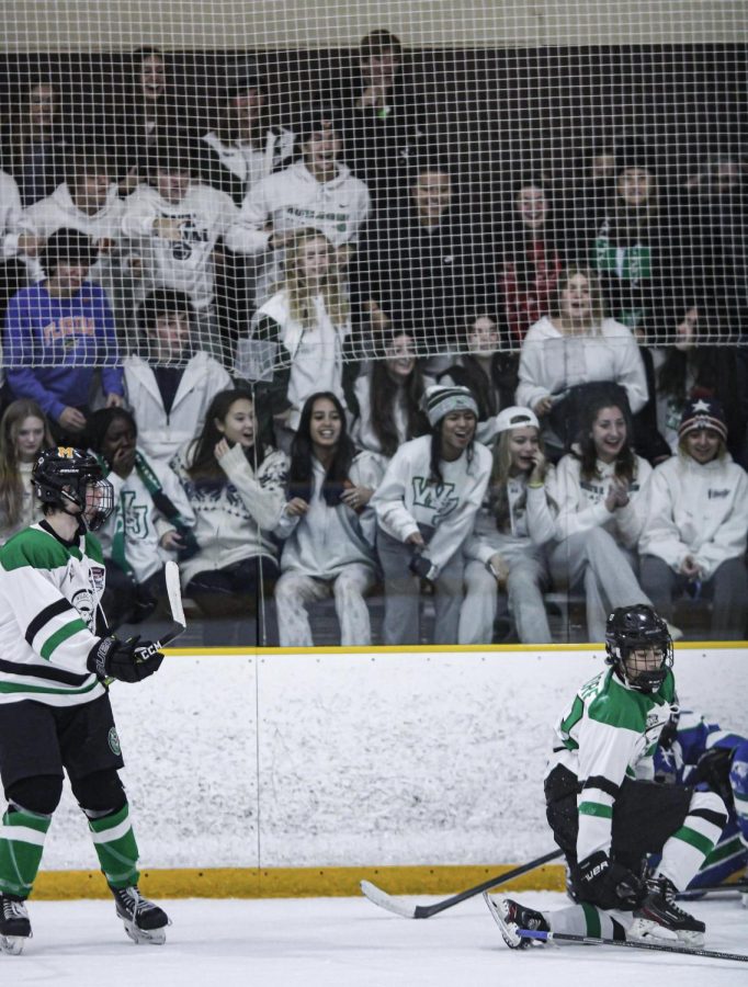 Senior and captain Ethan Birndorf picks up his stick after laying the boom on a Churchill player. The crowds energy was off the charts and contributed to a more physical affair.