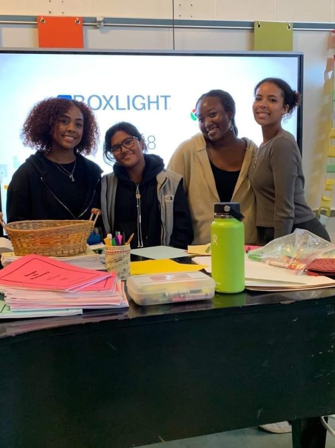 From+left%3A+Seniors+Danna+Taveras%2C+Alison+Razafimandimby%2C+Shiima+Nantulya+and+Yness+Seidnaly+write+encouraging+letters+for+Burundian+refugees+to+boost+their+spirits.