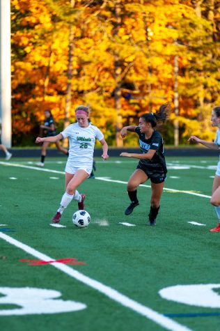 Freshman midfielder Evie Avillo dribbles past a Whitman defender. The Wildcats and Vikings pushed the game into overtime where the Wildcats eventually fell 2-1.