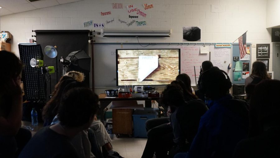 Film club members watch a film together in Room G86.