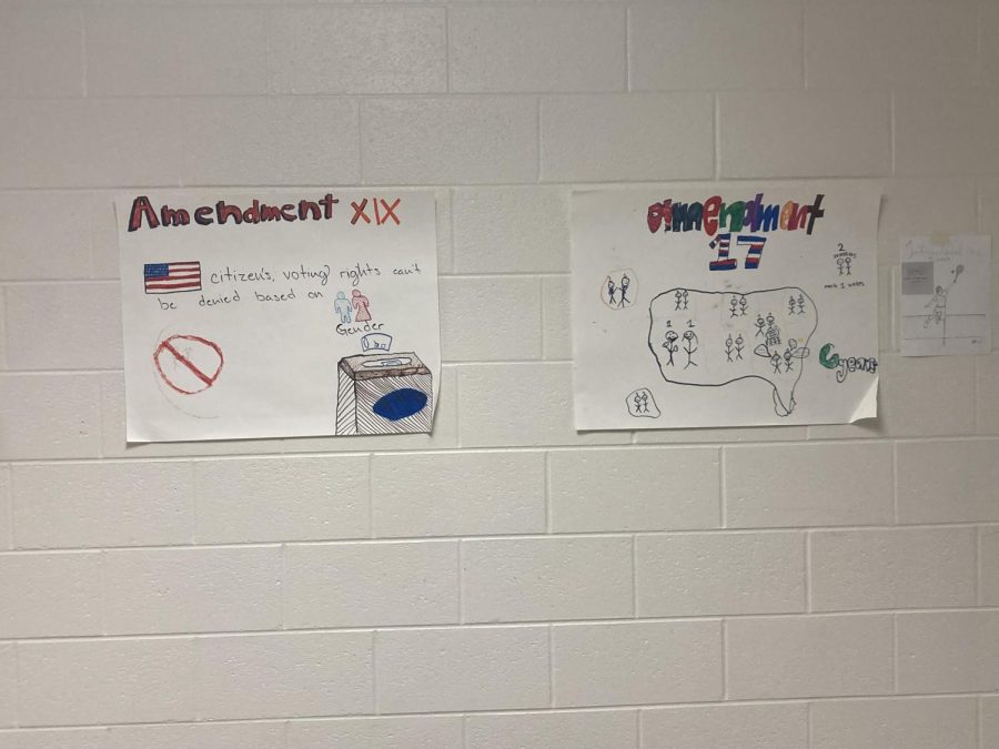 Posters made by AP Government students about constitutional amendments are on display in the hallway. AP Government students are expected to know all the constitutional amendments.
