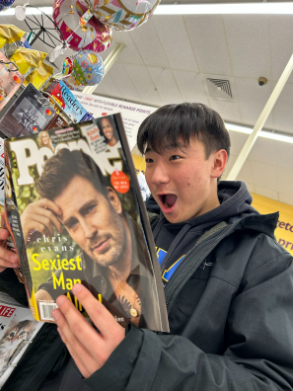 Junior Brandon Moon catches up with the latest copy of People Magazine on Nov 18 at Giant. He was shopping at Giant when the cover model of People Magazine, Chris Evans, caught his eye. “Chris Evans is a very fine looking man, but I personally believe that Michael B. Jordan should have won the [Sexiest Man Alive] title again,” Moon said.