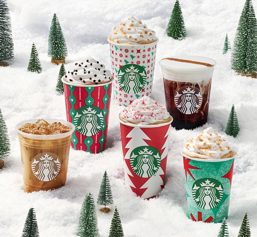 A showcase of colorful Starbucks holiday drinks.  During the winter season people line up out the door to sample these sweet or bitter drinks.